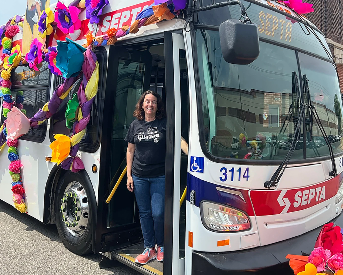 Alba Martínez, creator of La Guagua 47: An American Musical, standing on the SEPTA 47 bus. Photo courtesy of Alba Martínez.&nbsp;