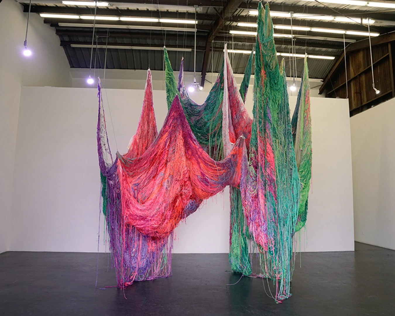 Carmen Mardonez, I dare, textile installation, 30 discarded bed sheets hand embroidered, 2022. Photo by Carmen Mardonez.&nbsp;