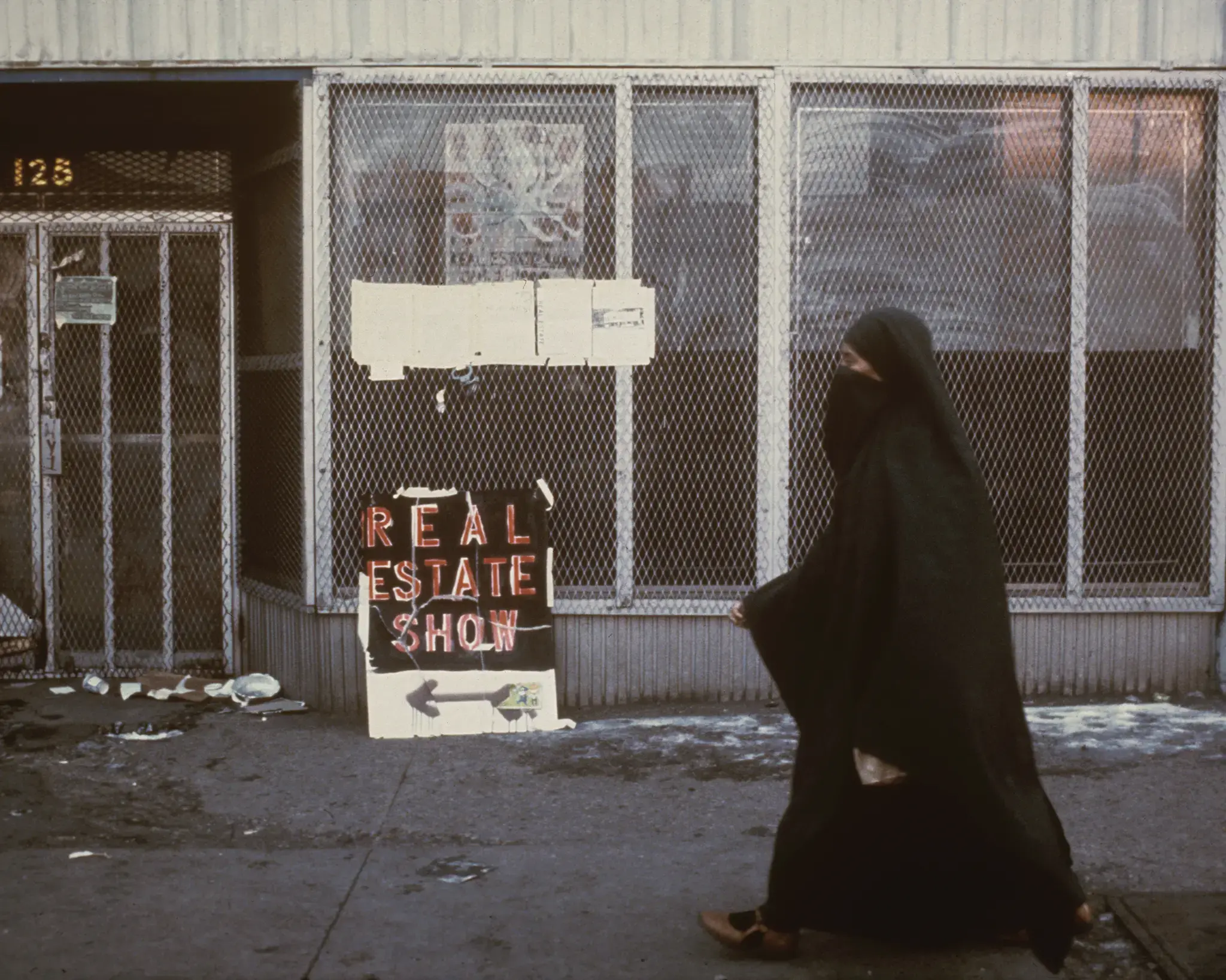 Passerby at 125 Delancey Street, site of The Real Estate Show. Photo by Anne Messner.