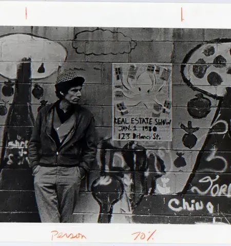 Alan W. Moore next to Becky Howland&#39;s octopus poster for The Real Estate Show. Photo &copy; 1980 Becky Howland.