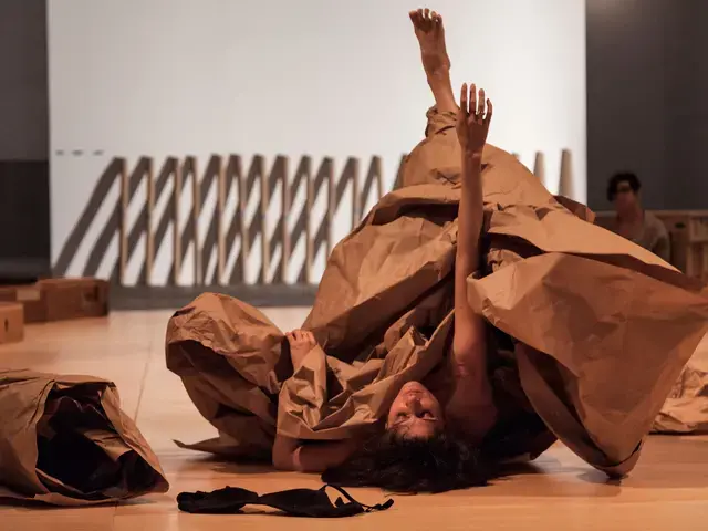 Janine Antoni in collaboration with Anna Halprin, Paper Dance, 2013. April 26, 2016 performance view from Ally, produced in collaboration with The Fabric Workshop and Museum. Photo by Carlos Avendaño. Courtesy of the artists and The Fabric Workshop and Museum.