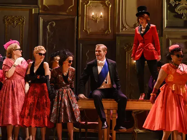 Opera Philadelphia presents Verdi&rsquo;s La Traviata. The Marchese (Jarrett Ott, seated) and Flora (Katherine Pracht) at Flora&rsquo;s ball in Act II. Photo by Kelly &amp; Massa.