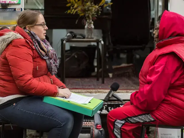 Erin Bernard interviews Gloria King in a vacant lot on North 13th Street in November 2014, for History Truck&#39;s 2015 exhibition They Say They Gonna Build. Photo by Mark Krendel.