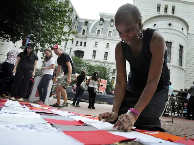 Philly ReACTS audience member contributes to the flag project. Photo by Michael Perez, courtesy of First Person Arts.