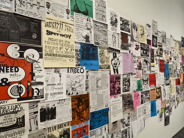 Installation shot of Alien She at the Miller Gallery at Carnegie Mellon University: Posters (c. 1991&ndash;present) from Riot Grrrl related shows, conventions and meetings internationally, solicited from institutional and personal archives through open calls, word-of-mouth, and invitations. Photo courtesy of the Miller Gallery at Carnegie Mellon University.