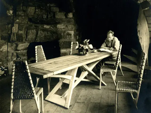 Wharton Esherick sitting at his trestle table in his studio, photograph, circa 1931. Photo courtesy of the Wharton Esherick Museum.