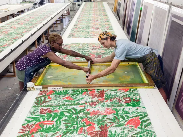 The Fabric Workshop and Museum, studio staff Joy O. Ude and Avery Lawrence print Will Stokes Jr.’s Hidden.&nbsp;Photo by Carlos Avendaño.