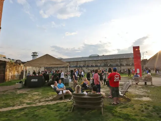 Visitors gather on Eastern State Penitentiary's baseball field for a season reception celebrating its newest site-specific artist installations, 2019. Photo courtesy of Eastern State Penitentiary.