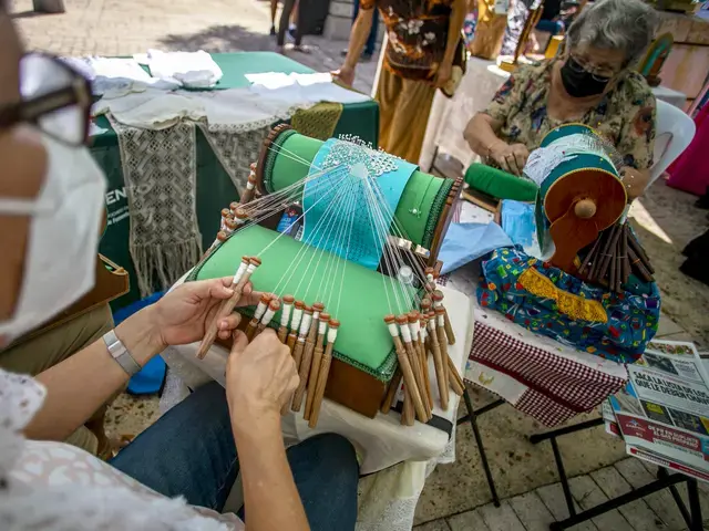 Carmen Arteaga demonstrates the intricate bobbin lace-making technique called mundillo, or “little world.” Guatemalan and Puerto Rican designers are leading textile workshops for Taller Puertorriqueño’s Tramando. Photo by Xavier Garcia, courtesy of Taller Puertorriqueño.