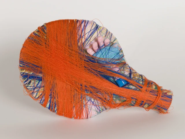 Cindy Gosselin, Untitled, 2022; mixed media sculpture with acrylic thread, wood, tinsel, foam, ping pong racket, plastic doll hand. Image courtesy of the Hurford Center for the Arts and Humanities.