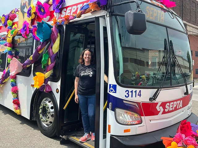Alba Martínez, creator of La Guagua 47: An American Musical, standing on the SEPTA 47 bus. Photo courtesy of Alba Martínez.&nbsp;