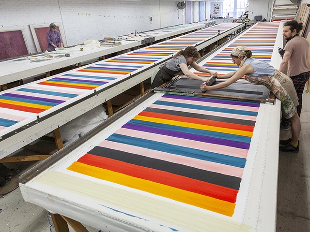 The Fabric Workshop and Museum's Print Project Manager Jill Adler (at right), screenprints Mary Heilmann’s Serape yardage with Studio Assistant Andrea Arts and Senior Project Technician Allen West (at right). Photo by Carlos Avendaño.
