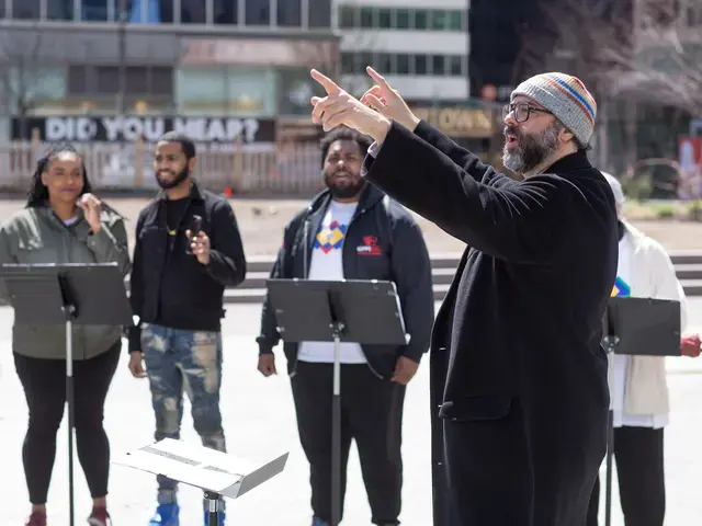 Lead artist and composer Ari Benjamin Myers conducts “Duet” in Love Park, Rehearsing Philadelphia, Curtis Institute of Music and Drexel University’s Westphal College of Media Arts &amp; Design, 2022. Photo by Conrad Erb.