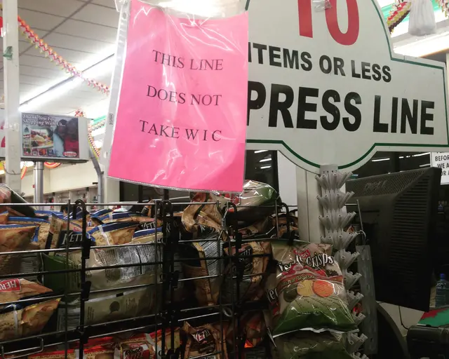 WIC grocery store line sign, 2015. Photo by Erin Bernard.