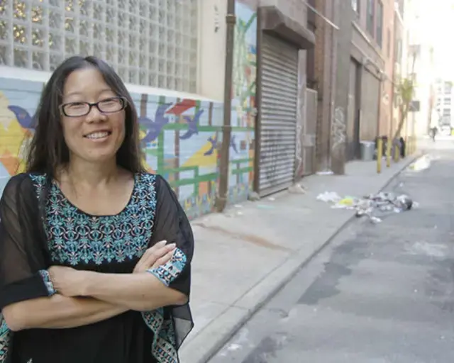 Gayle Isa, executive director of Asian Arts Initiative, on Pearl Street. Photo by Akira Suwa, courtesy of the Philadelphia Inquirer.