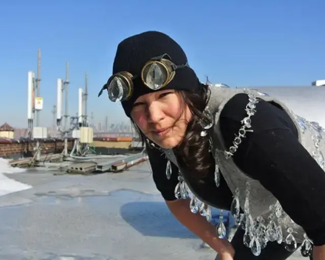 Artist Maria Hupfield. Roof top crystal chandelier vest with goggles, 2015. Courtesy of Vox Populi Gallery.