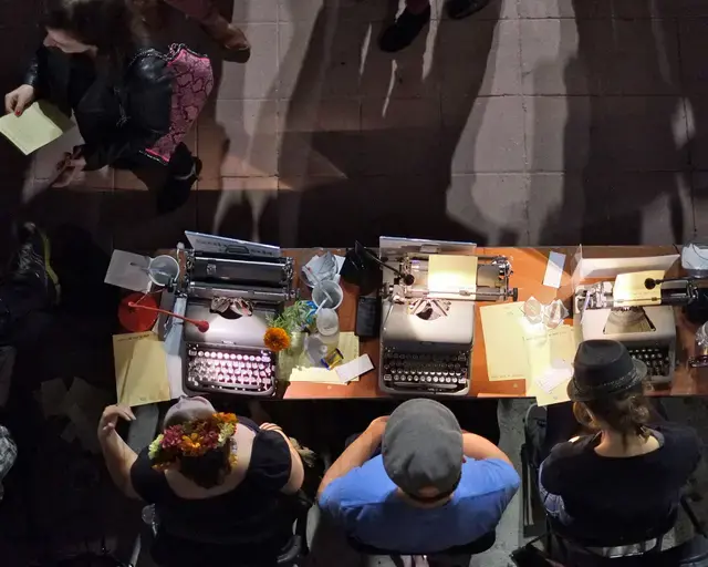 A &ldquo;Poetry Bureau,&rdquo; created by the Center for the Art of Performance at UCLA, Westwood Village, 2013. Featuring a group of volunteer poets who write a spontaneous verse for visitors, the bureau appears outside the theater prior to a related performance. Photo by Phinn Sriployrung&nbsp;