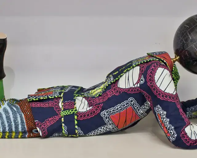 Yinka Shonibare MBE, Planets in My Head, Philosophy, 2011. Mannequin, Dutch wax printed cotton, leather and fiberglass, 16 x 16 x 45 inches. Collection of Charlotte and Herbert Wagner, Boston, MA. &copy; The Artist/Courtesy James Cohan Gallery, New York/Shanghai.