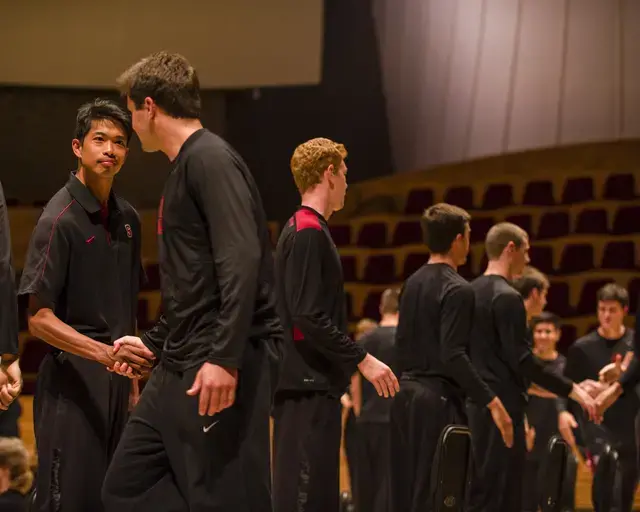 Volleyball players shake hands as part of Ann Carlson&#39;s The Symphonic Body: Stanford at the Performance Studies International 19 conference, June 2013. Photo by Toni Gauthier.