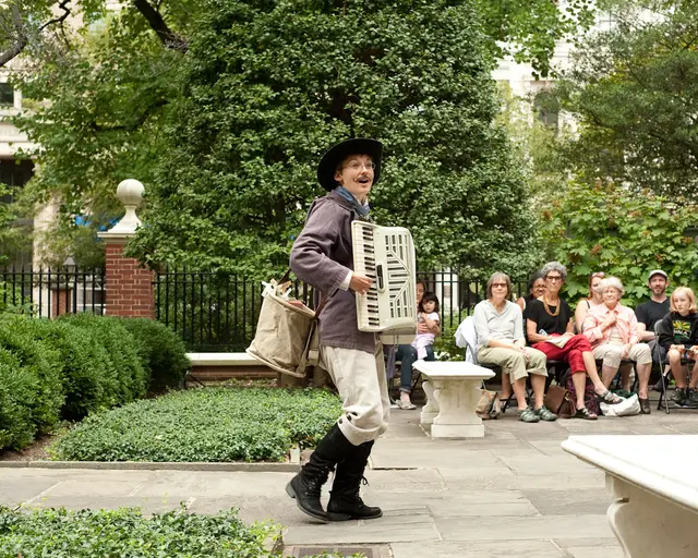 Aaron Cromie&rsquo;s A Paper Garden, commissioned and produced for the American Philosophical Society Museum&rsquo;s Greenhouse Projects. Photo by Brent Wahl. Pictured: Genevieve Perrier [in the dress] and Mary Tuomanen [in the hat].