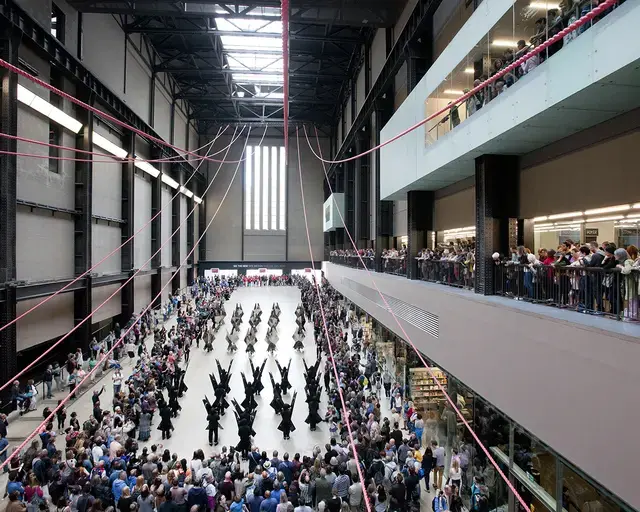 Up Hill Down Hall: An Indoor Carnival, 90-minute processional performance guest curated by Claire Tancons for the BMW Tate Live Series, Turbine Hall, Tate Modern, London, August 23, 2014. Featured: Marlon Griffith&rsquo;s No Black in the Union Jack under Gia Wolff&rsquo;s Canopy. Photo by Oliver Cowling &copy; Tate, 2014.