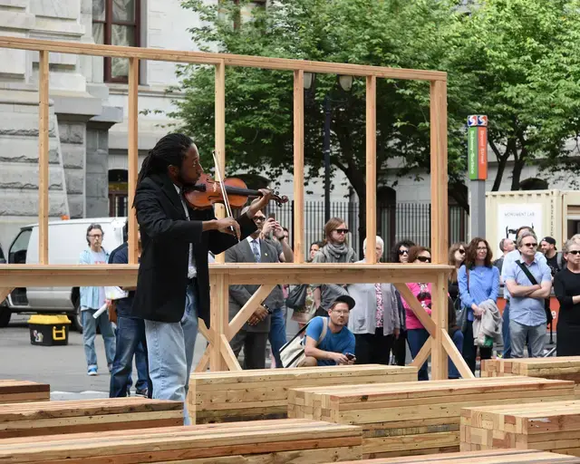 A senior from Masterman High School performs at the opening of Monument Lab, at Terry Adkins&#39; temporary monument in City Hall Courtyard. Photo by Lisa Boughter.