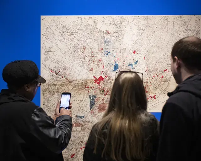 Wall installation of a redlining map from the J. M. Brewer Survey of Philadelphia, William B. Dietrich Gallery at Parkway Central Library. Photo by Ryan Brandenberg.&nbsp;