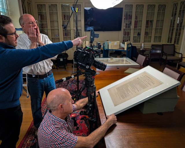 Film series director Andrew Ferrett and key crew preparing to film copy of the Declaration of Independence printed in 1776 at American Philosophical Society; May 12, 2025. Photo by Jonathan Kohl, courtesy of History Making Productions.&nbsp;
