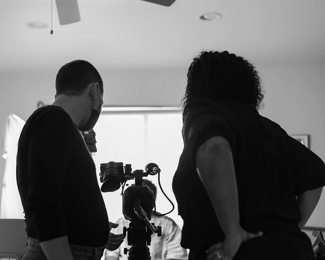 Pew Fellow Jos Duncan Asé (right) and cinematographer Marie Hinson behind the scenes on set of Queen Mother: Falaka Fattah &amp; The House of Umoja film shoot. Photo by Tezarah Wilkins.