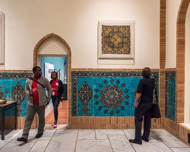 Mosaics and woven textiles capture the attention of visitors wandering in the Safavid Court. Photo courtesy of Philadelphia Museum of Art.