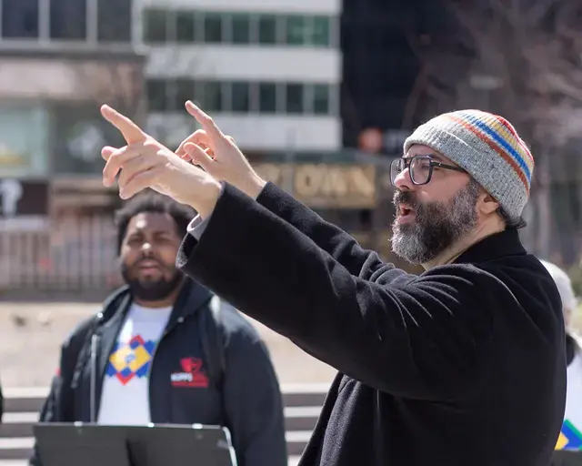 Lead artist and composer Ari Benjamin Myers conducts “Duet” in Love Park, Rehearsing Philadelphia, Curtis Institute of Music and Drexel University’s Westphal College of Media Arts &amp; Design, 2022. Photo by Conrad Erb.