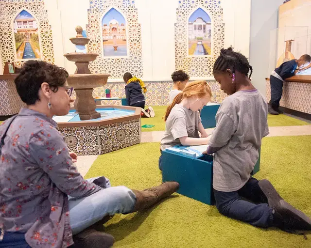 Please Touch Museum, America to Zanzibar, exhibit courtyard and fountain filled with visitors’ shared wishes for the world. Photo courtesy of the Please Touch Museum.