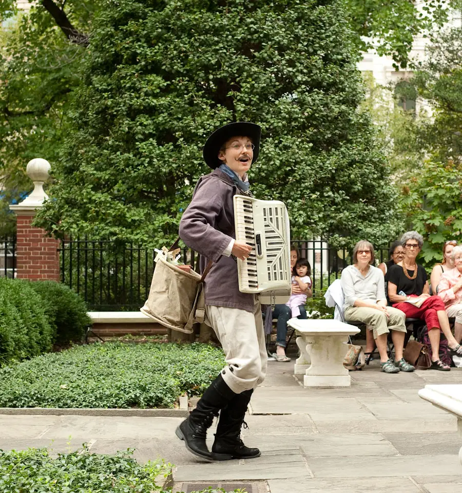 Aaron Cromie&rsquo;s A Paper Garden, commissioned and produced for the American Philosophical Society Museum&rsquo;s Greenhouse Projects. Photo by Brent Wahl. Pictured: Genevieve Perrier [in the dress] and Mary Tuomanen [in the hat].