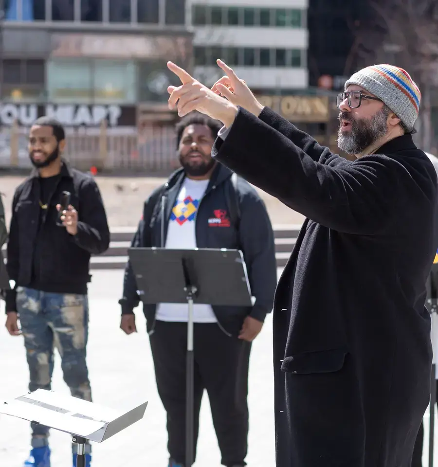 Lead artist and composer Ari Benjamin Myers conducts “Duet” in Love Park, Rehearsing Philadelphia, Curtis Institute of Music and Drexel University’s Westphal College of Media Arts &amp; Design, 2022. Photo by Conrad Erb.